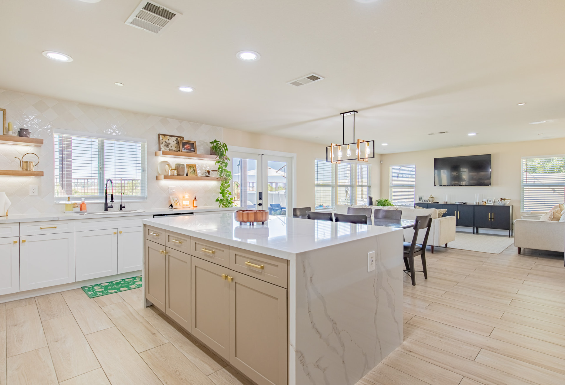 Open-concept kitchen and living room with natural light